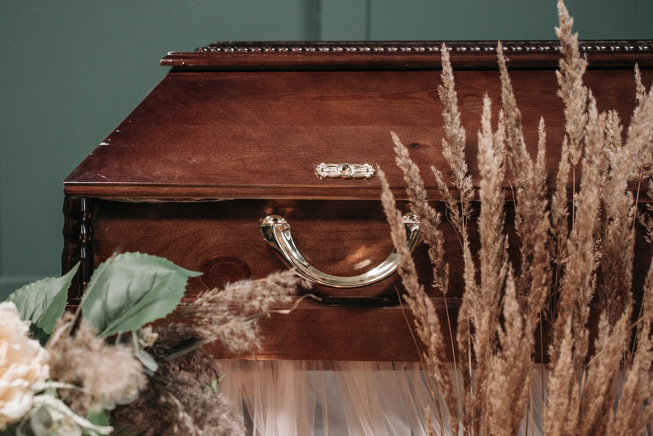 dried flowers and coffin